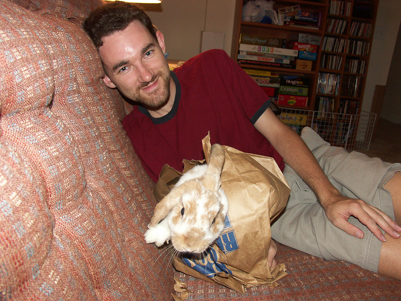 Milo hated being handled, but we found if we carried him in a paper bag, we could put him on the couch (10/2005)